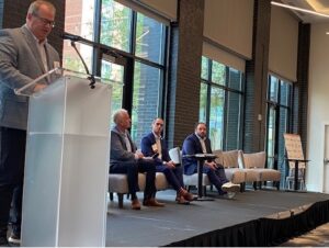 Speakers on stage at the Montrose Group economic development policy forum